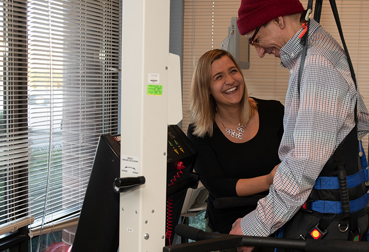 Braintree Outpatient team member assisting patient with rehab