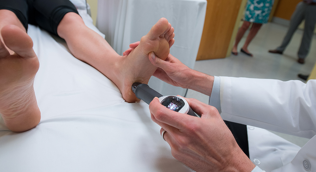 Physician using medical tool at Spaulding Outpatient Center Cambridge