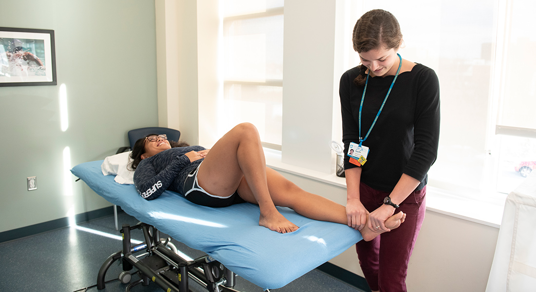 Physical therapist rehabbing patient at Spaulding Outpatient Center South Shore YMCA Quincy