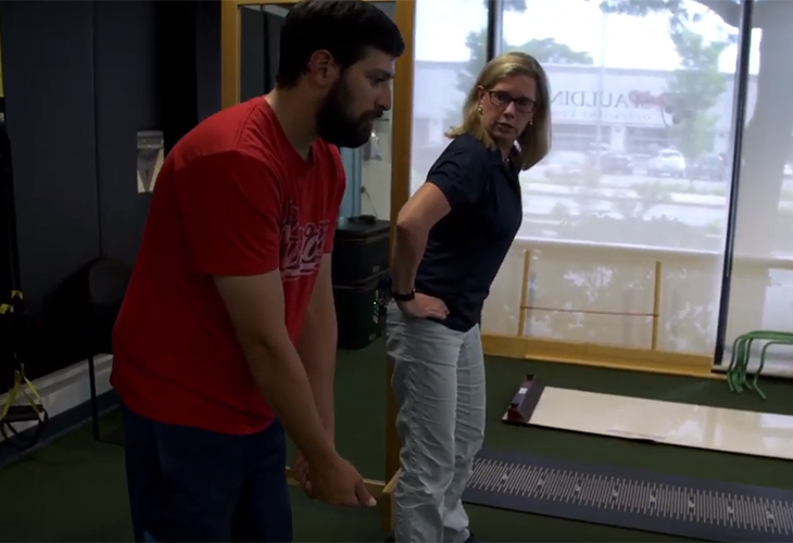 Photo of therapist and golfer