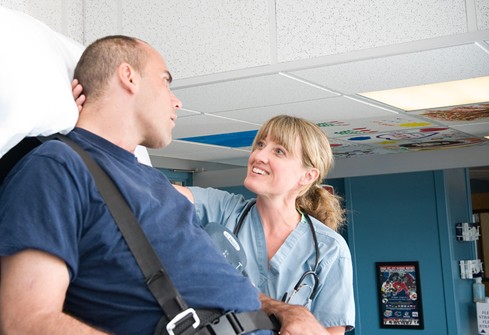 Nurse assisting Spaulding patient