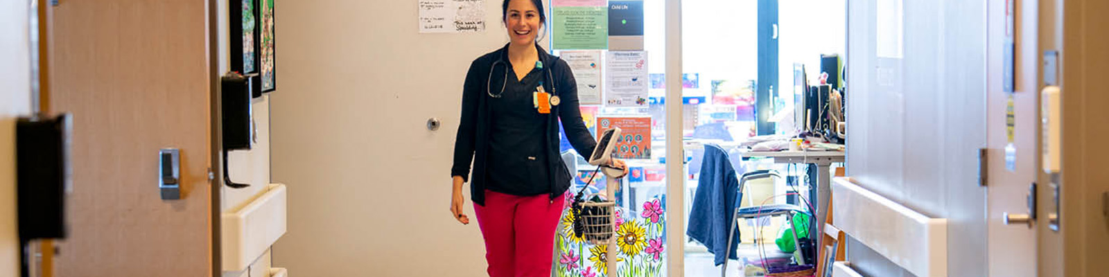 Image of Resident walking down Spaulding hallway