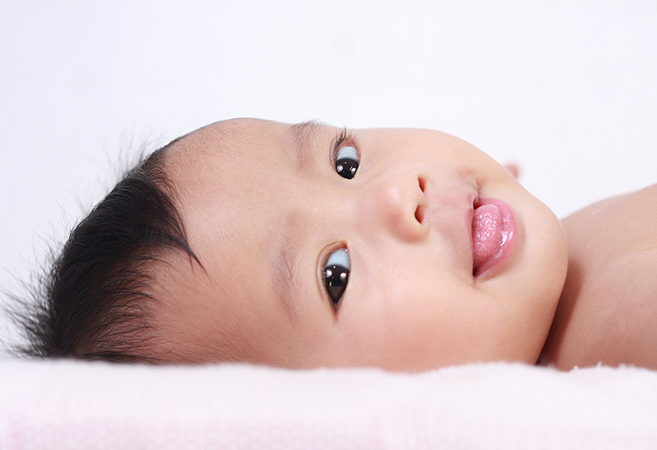 baby with tongue sticking out
